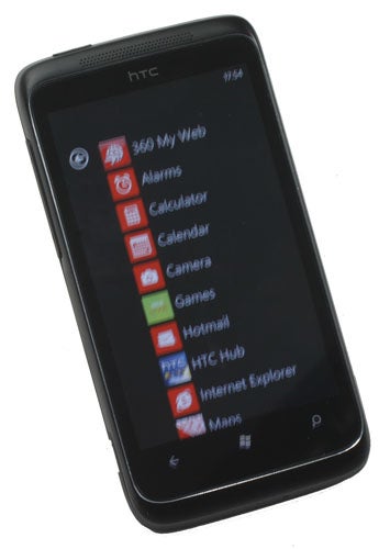 HTC 7 Trophy smartphone displaying home screen with apps.