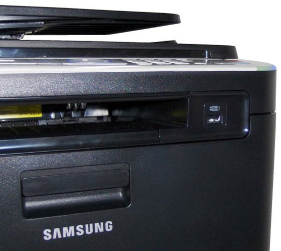 Close-up of Samsung CLX-3185FW multifunction printer's control panel.