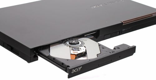 Acer Aspire Revo RL100 with open disk drive tray.