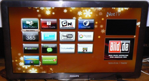 Smart TV displaying various streaming and app icons on screen.