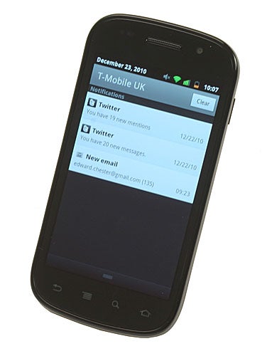 Google Nexus S smartphone displaying notifications on screen.