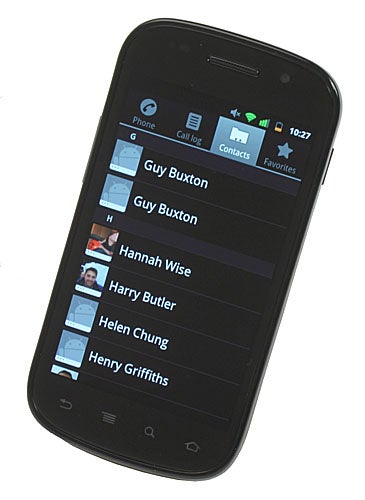 Google Nexus S smartphone displaying contacts list on screen.