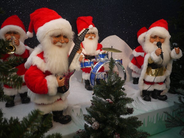 Band of Santa Claus figures playing musical instruments.