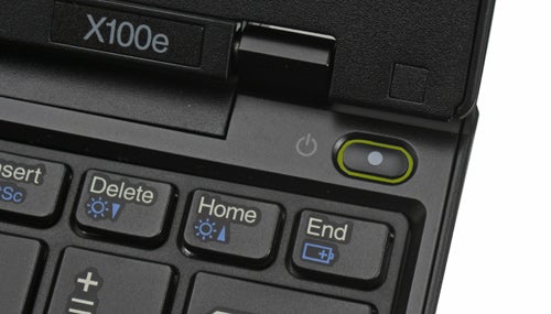 Close-up of Lenovo ThinkPad X100e keyboard and power button.