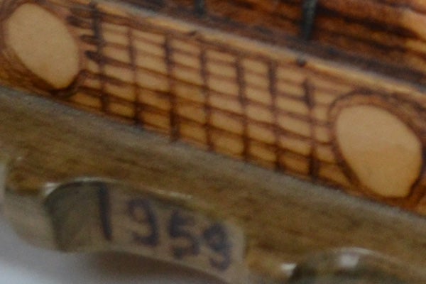 Close-up of a textured surface with the numbers 1959.