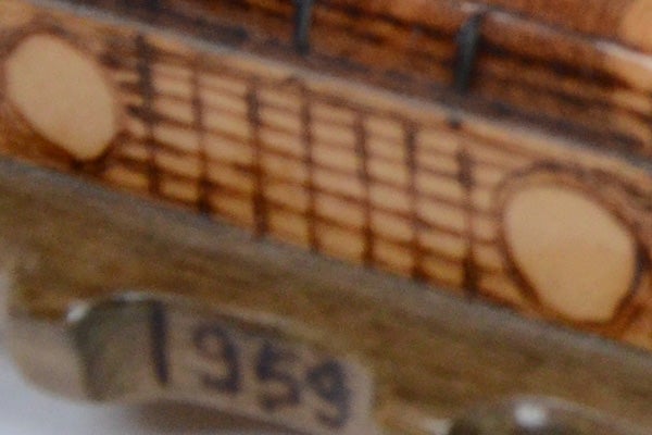 Close-up of wooden ruler showcasing camera's focus issue.