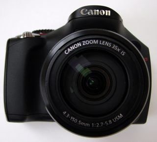 Canon PowerShot SX30 IS camera with zoom lens displayed.