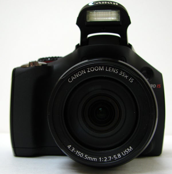 Canon PowerShot SX30 IS camera front view with lens and flash.