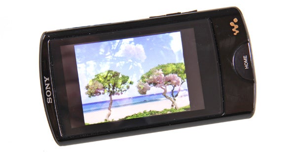 Sony Walkman MP3 player displaying a beach scene photo.