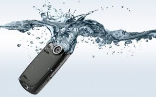 Kodak Playsport Zx3 waterproof camera submerged in water.
