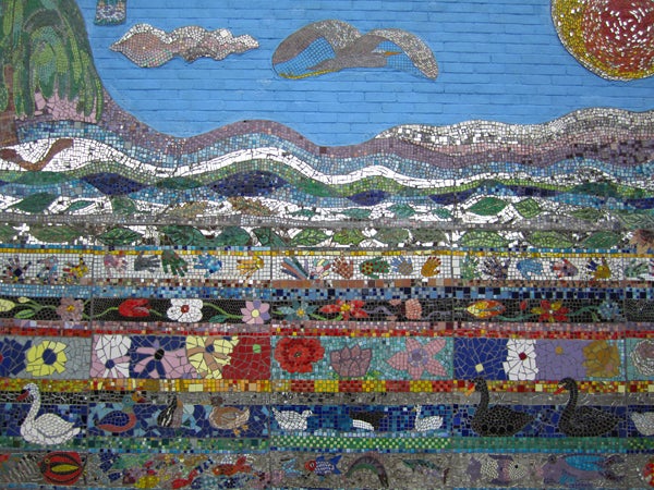 Colorful mosaic wall with marine life theme.