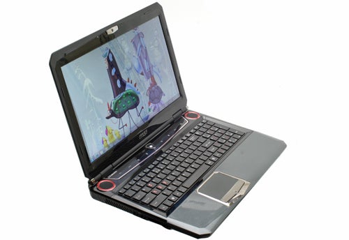 MSI GT680 gaming laptop with open lid displaying screen.