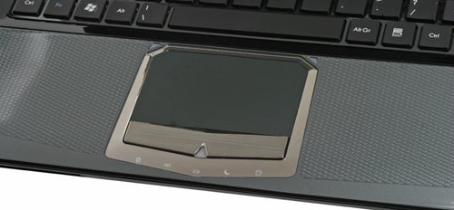 Close-up of MSI GT680 laptop's touchpad and keyboard area.