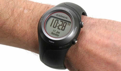 Garmin Forerunner 410 GPS watch on a person's wrist.