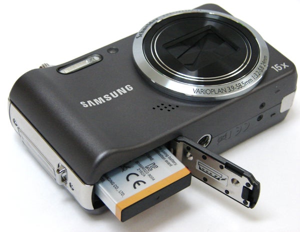 Samsung WB600 camera with open battery compartment.