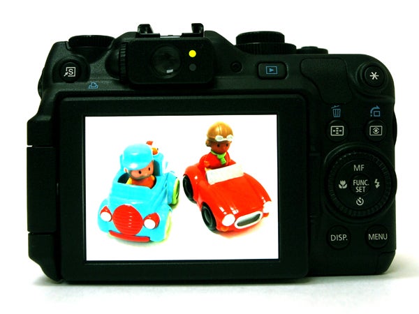 Canon PowerShot G12 displaying photo of toy cars.