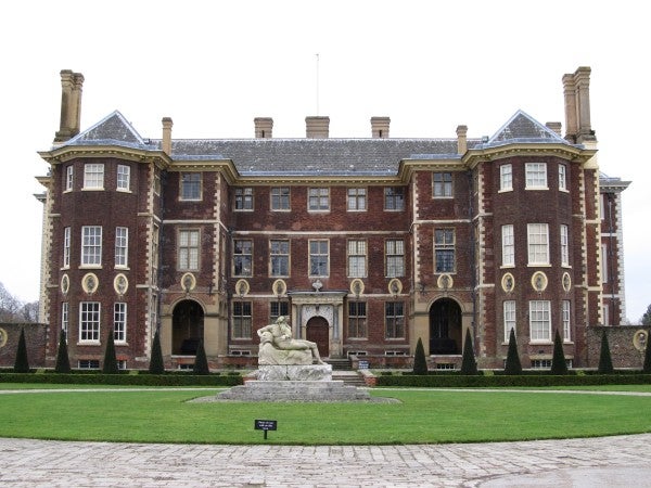 Photo of a stately manor with a statue taken by Canon SX130 IS.