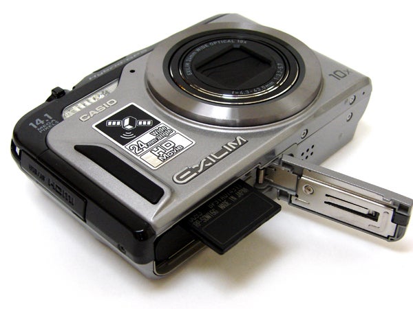 Casio Exilim EX-H20G digital camera with open battery compartment.