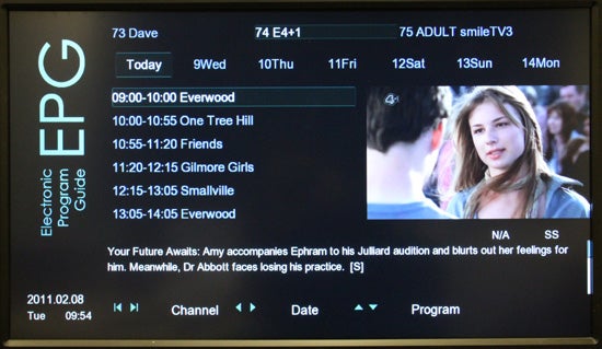 Electronic program guide on a screen with TV show listings.