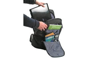 Person packing a laptop into a Dicota Take.Off Sport Bag.