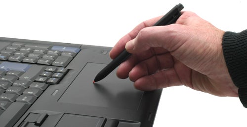 Hand using stylus on Lenovo ThinkPad W701ds TrackPoint.
