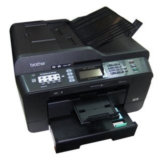 Brother MFC-J6910DW multifunction printer on table.