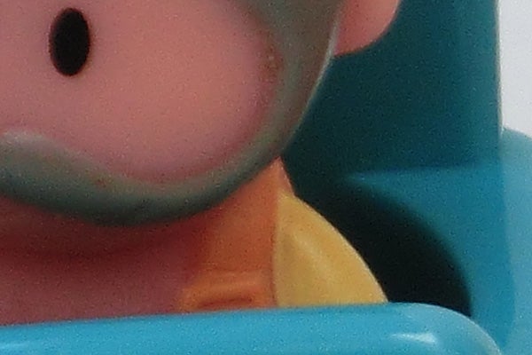 Close-up of a toy's face showing camera's macro capabilities