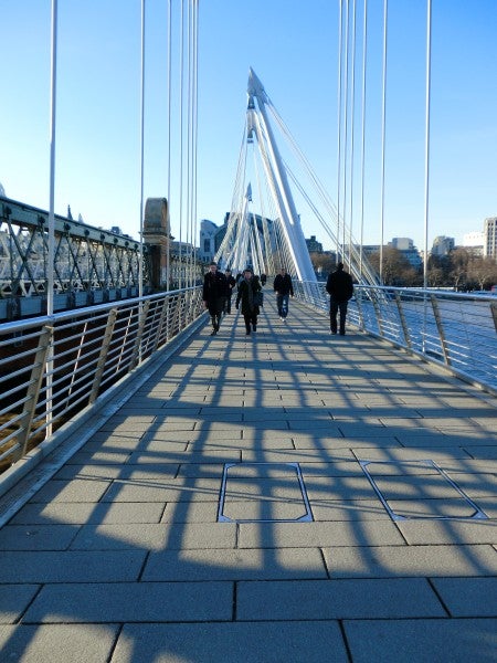 Casio Exilim EX-ZR10 photo of pedestrians on a bridge.