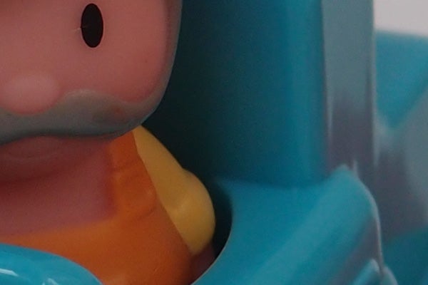 Close-up of a toy figure captured by Olympus XZ-1 camera.