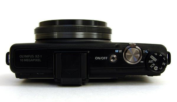 Olympus XZ-1 camera from top showing dials and controls.