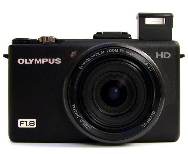 Olympus XZ-1 camera with built-in flash deployed.