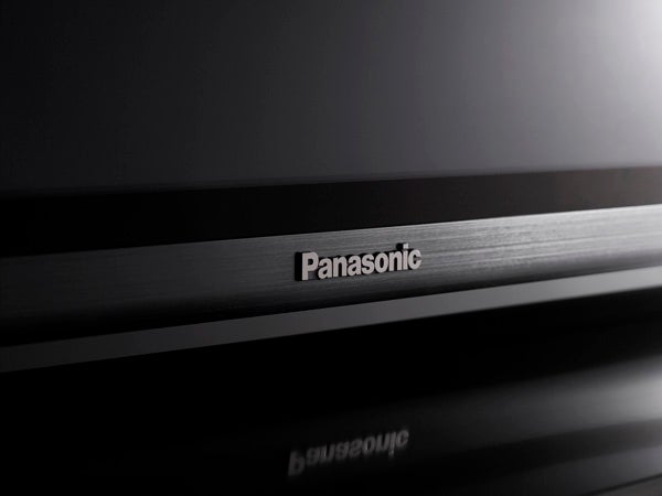 Close-up of Panasonic logo on a black electronic device.