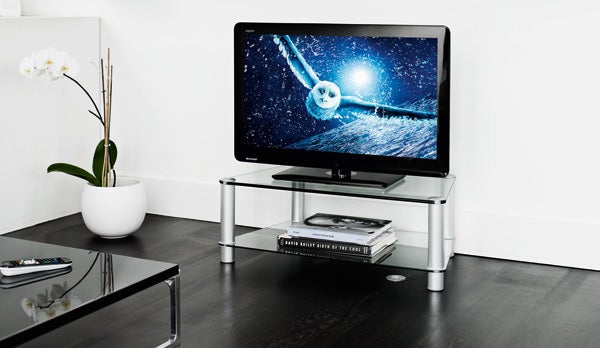 Sharp Aquos LC-37LE320E LCD TV on modern glass stand.