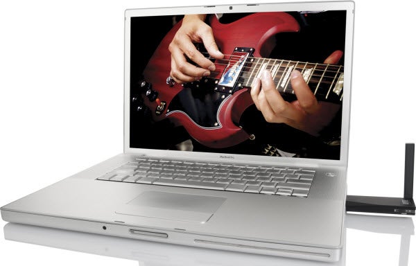 Laptop with person playing guitar on screen, no speaker visible.