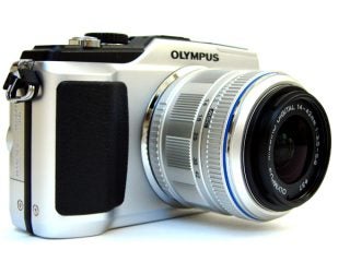 Olympus E-PL2 camera with 14-42mm lens on white background.