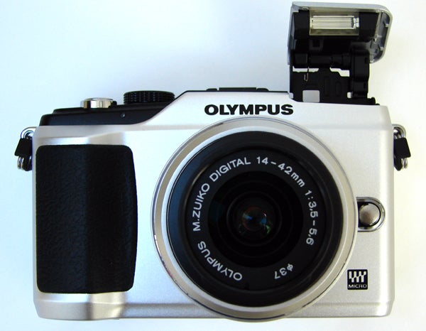 Olympus E-PL2 camera with open flash, white body, black lens