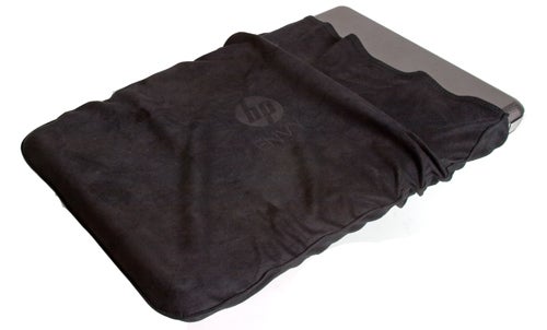 HP Envy 17 3D laptop in protective sleeve on white background.