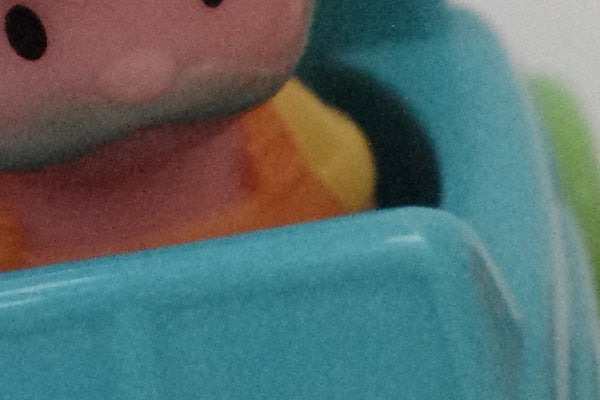 Close-up of a toy's face with blurred background