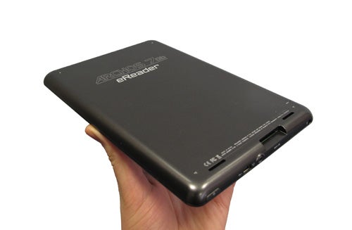 Hand holding an Archos 70b eReader from the back angle.