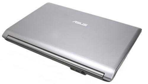 Asus N73Jn laptop closed, showing silver lid with logo.