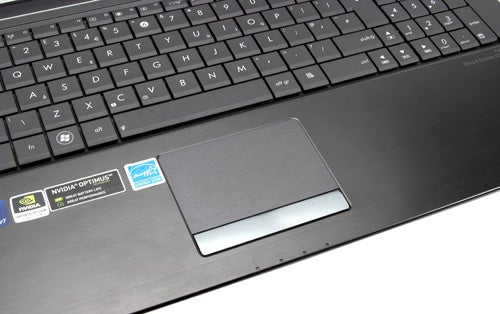 Asus N73Jn laptop keyboard and trackpad close-up.