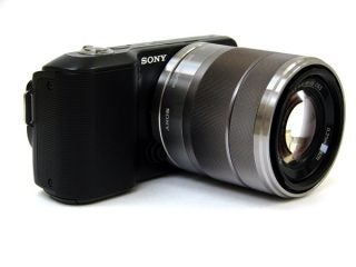 Sony Alpha NEX-3 camera with a large zoom lens.