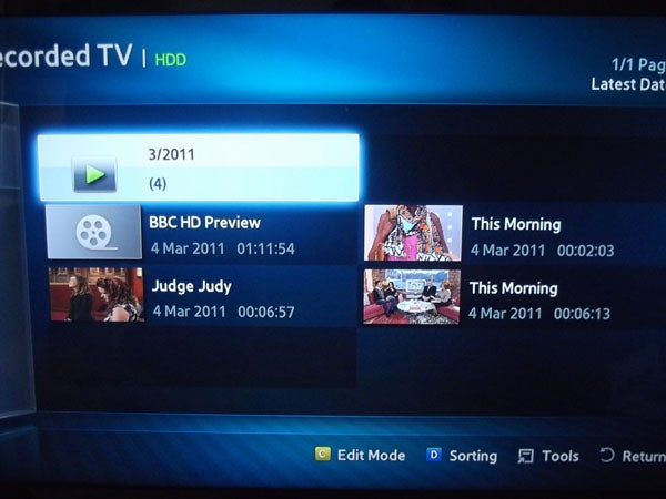 Samsung BD-D8500 interface showing recorded TV programs list.Samsung BD-D8500 interface showing partial delete function on TV screen.
