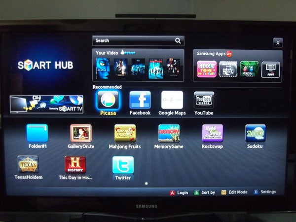 Samsung Smart TV displaying Smart Hub interface with apps.
