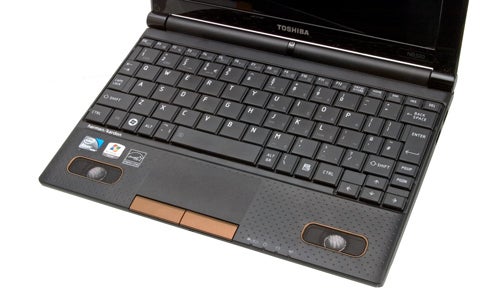 Close-up of Toshiba NB520 netbook keyboard and trackpad.