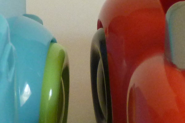 Close-up of colorful mugs blurred on edges