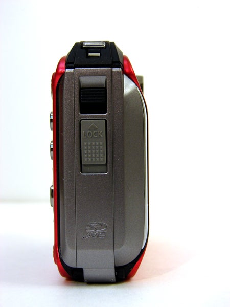 Side view of Panasonic Lumix DMC-FT3 camera with lock mechanism.