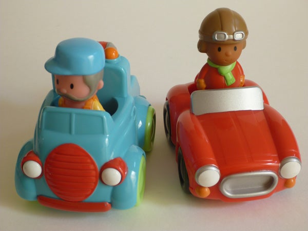 Toy cars with cartoonish drivers on white background.
