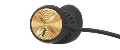 Close-up of Marshall Minor earbud with gold details.