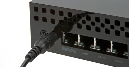 Lacie Wireless Space router with connected Ethernet cable.